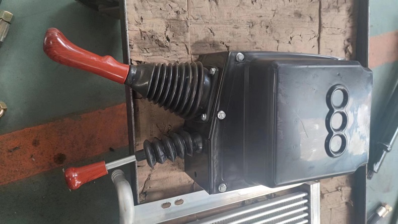 Loader single rod operated mechanical handle