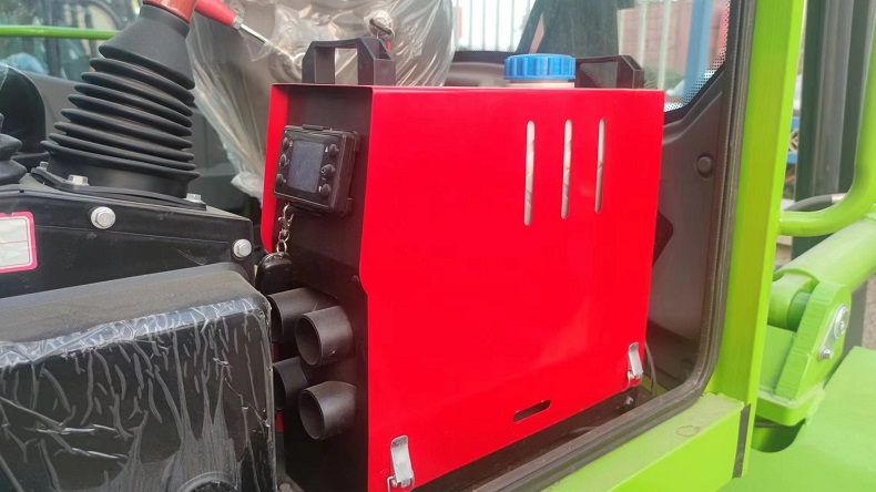 A picture of an outdoor forklift with a diesel heater installed in the cabin. The diesel heater is a red box with a black label and a silver exhaust pipe. The forklift is parked on a snowy ground, and the cabin is warm and cozy.
