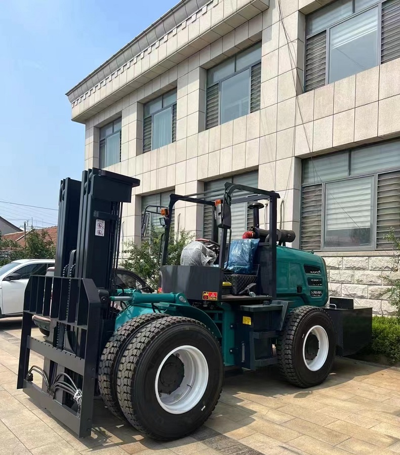 a blue color,6 ton capacity Articulated four-wheel drive forklift. Customized static height.