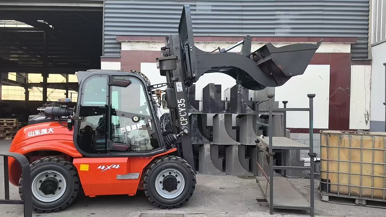 Rough terrain forklift with super bucket performing bulk material loading on construction site