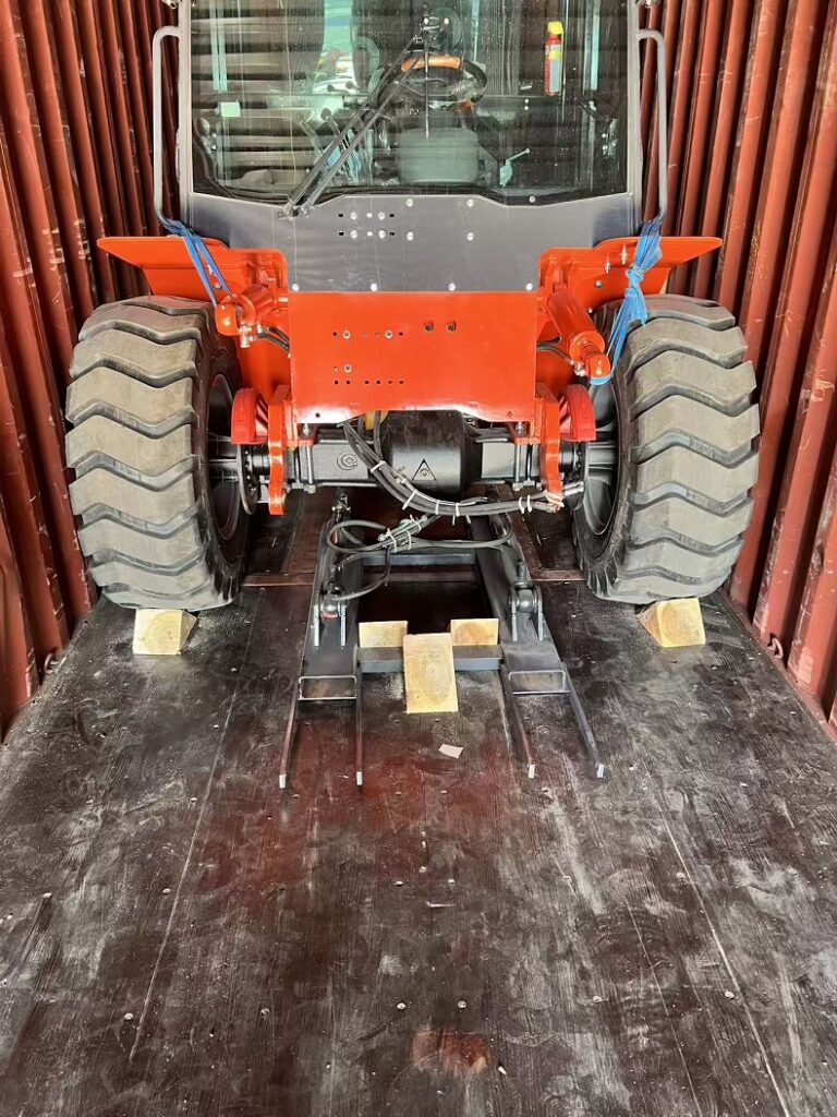 Kaystar 4x4 rough terrain forklift being loaded into 20ft container at factory